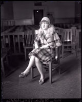 Edith Andrews seated in a courtroom alone during her divorce from film director Del Andrews, Los Angeles, 1928