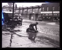 Flooded commercial street after heavy rain, Los Angeles, 1926