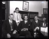 David H. Clark seated among unidentified men, Los Angeles, 1931