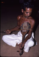 Sarpam Thullal Pulluvan Serpent Ritual - O. K. Raman demonstrates a Pulluvan vīṇā kunju, Peramangalam (India), 1984