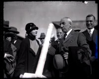 Actress Anna Q. Nilsson greets explorer Roald Amundsen with an ice pole, Union Station, Los Angeles, 1926