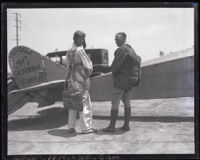 Parachutist Frank Austin and parachute inventor Heard McClellan in an airfield, Los Angeles, 1926