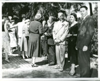 Dr. John A. Somerville at a gathering in a garden, 1950s