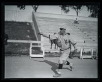 Fay Scow Thomas pitching a baseball for USC, Los Angeles, circa 1925