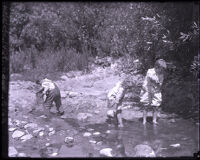 Children wade in Arroyo Seco creek, Los Angeles County, circa 1925