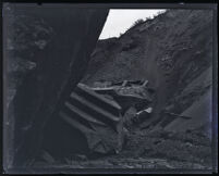 Large stepped piece of the Saint Francis Dam on the canyon floor after its collapse, San Francisquito Canyon (Calif.), 1928