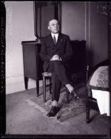 Charles F. Abbott of the American Institute of Steel Construction sitting, Los Angeles, 1926