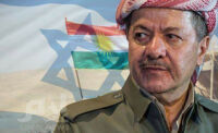 Masoud Barzani with Kurdistan and Israel flags in the background