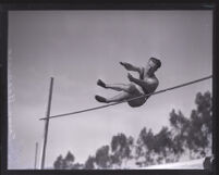 Frank Bradshaw, Occidental College athlete, completing the high jump, Los Angeles,