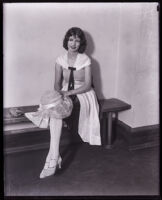 Virginia Cassavoy seated on a bench, Los Angeles, 1928