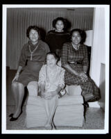 Four women on an armchair, related to Vennda Rei McFarlin Hewitt, 1950-1970