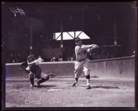 Baseball player Les Cook mid swing at home plate at Washington Park, Los Angeles, circa 1925
