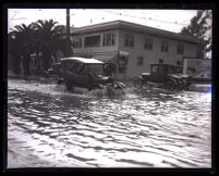 Flooded commercial intersection after heavy rain, Los Angeles, 1926