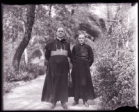 Bishop John J. Cantwell standing next to an unidentified clergyman, Los Angeles County, 1920s