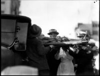 Stand collapse victim on stretcher at Tournament of Roses parade, 1926
