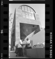 Workman polishing the main entrance sign to MOCA, Los Angeles, 1986