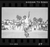 Roller skater performing for crowd in Venice Beach, Calif., 1986