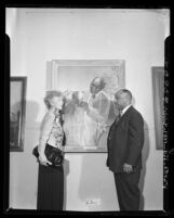 Artist Betsy Graves Reyneau and AACP president Thomas L. Griffith standing besides portrait of Dr. George Washington Carver, 1948