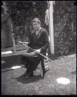 Abbie A. Adams sitting in a chair holding sword from the Mexican War, Los Angeles, 1929