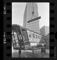 One of the original cars of Angels Flight being moved by crane for storage in Los Angeles, Calif., 1971