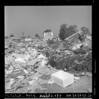 Garbage and debris surrounding sign reading "State Property No Dumping No Parking No Trespassing" in San Fernando Valley, Calif., 1971