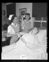 Laura Tydings and Esther May Rogers learn nursing procedures on dummy patient in Los Angeles, Calif., 1949