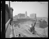 Excavators at Ft. Moore Hill preparing for construction of bridge joining Hill and Castelar Sts., Los Angeles, 1949