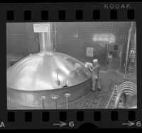 Worker adding ingredients to brew kettle at Anheuser-Busch brewery in Van Nuys, Calif., 1972