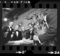 Actors on the set of "The Poseidon Adventure" celebrating their Oscars wins, 1972