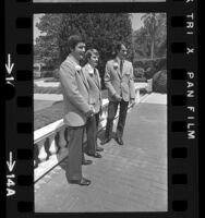 First three males to graduate from Western Airlines stewardess school, Los Angeles, Calif., 1972