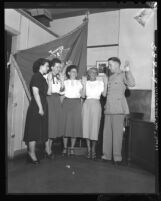 Major R. W. Rynerson swears in new U.S. Women Marines Kerstin Schelin, Lola Thorogood, Dolores Swan and Jeanne Cadette, Calif., 1949