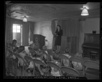 Mrs. Jack Joseph teaching Sunday school to youngsters at Westchester Methodist Church and Jewish Congregation in Los Angeles, Calif., circa 1947