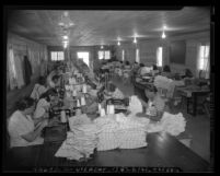Women inmates employed in sewing at California Correctional Institution's industrial program in Tehachapi, Calif., 1948