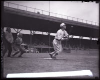 Baseball player Sam Crawford after hitting a ball at Washington Park, Los Angeles, circa 1920