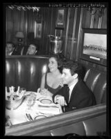 Elizabeth Taylor and singer Eddie Fisher dine out at Chasen's restaurant in Los Angeles, Calif., 1959