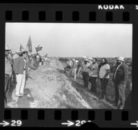 Teamsters standing guard against picketing United Farm Workers on Carian Ranch in Coachella Valley, Calif., 1973
