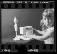 Five-year-old Dawn Lombardi using Mattel's Sew Magic toy sewing machine in Los Angeles, Calif., 1973