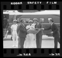 Skylab astronaut Pete Conrad presenting plaques to Soviet Leonard I. Brezhnev and President Richard Nixon in San Clemente, Calif., 1973