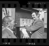 Merle Mergell demonstrating computer-controlled traffic signal system in Inglewood, Calif., 1973