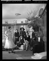Carmelita Eskew modeling dress for the Delta Tau Delta Mothers Club at the fraternity's house in Los Angeles, Calif., circa 1950