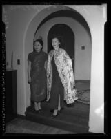 Mrs. T. B. Chew Jr. and Mrs. Joe Ling modeling traditional Chinese clothing at Chinese American fashion show, Calif., 1950