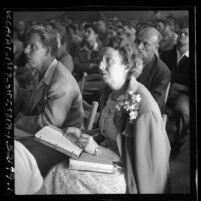 Woman taking notes at L. Ron Hubbard's Dianetics seminar in Los Angeles, Calif., 1950