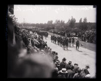 Soldiers marching in front of crowd during Memorial Day celebration at Exposition Park, Los Angeles, 1930