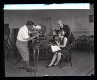 Anita Page with Rufus B. von Kleinsmid talking into a telegraphone, Los Angeles, 1935