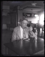 Los Angeles Health Commissioner Dr. George Parrish eating lunch, Los Angeles, circa 1925