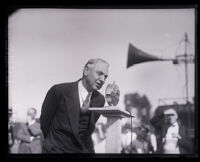 Mayor John C. Porter speaking at microphone, Los Angeles, 1929-1933