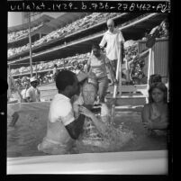 People being baptized during Jehovah's Witnesses convention at Dodger Stadium in Los Angeles, Calif., 1974