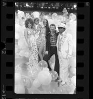 Designer Bob Mackie with Bette Midler, Elton John, Cher and Flip Wilson in television studio, Los Angeles, 1975
