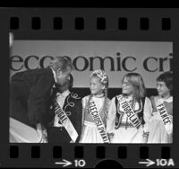 Entertainer Danny Kaye talking with members of the International Children's Choir in Los Angeles, Calif., 1975