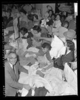 Shoppers clamoring for clothes at May Co. Anniversary Sale in Los Angeles, Calif., circa 1954